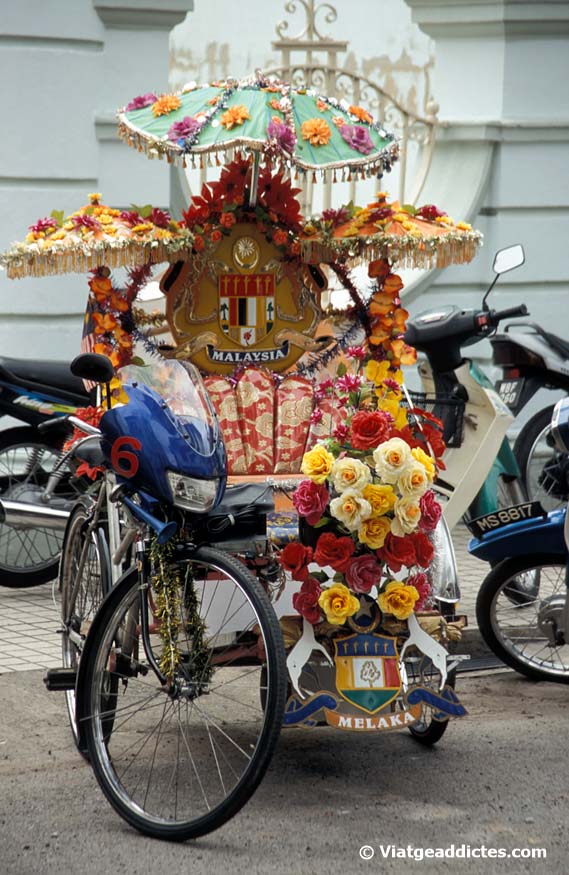 Melaka (Malaysia). This modified cycle-rickshaw is an effective way to attract our attention