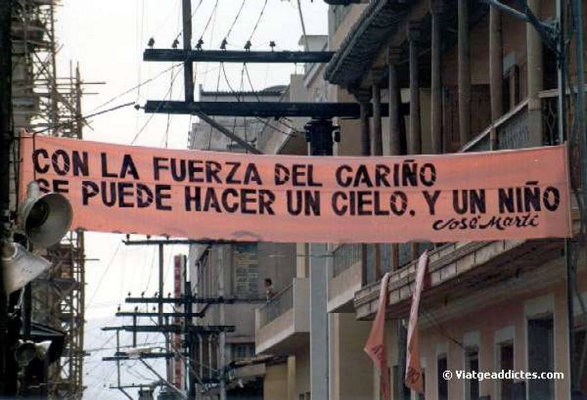 Santiago de Cuba (Cuba). The sign says: �With the power of love an sky can be done. And a boy�. A revolutionary message to promote the birth rate